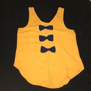 Bright Orange Tank Top with Blue Bows on the back.